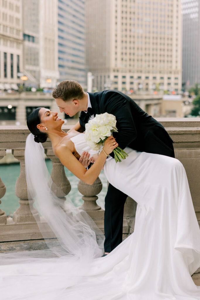 A beautiful wedding portrait of a bride and groom on the Chicago Riverwalk