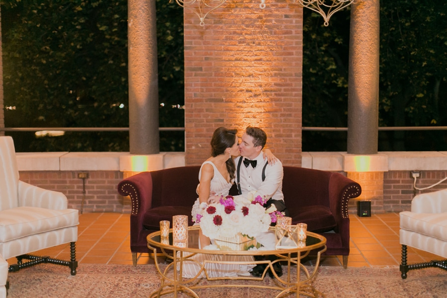 An evening wedding portrait on the loggia of Cafe Brauer.