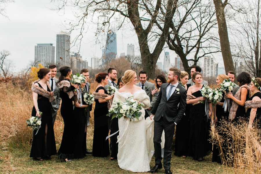 A candid portrait of a wedding party posing in Lincoln Park.