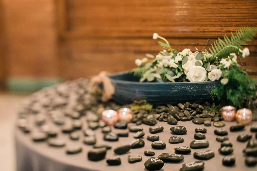 Guests found their names written in calligraphy on river rocks to escort them to their tables.