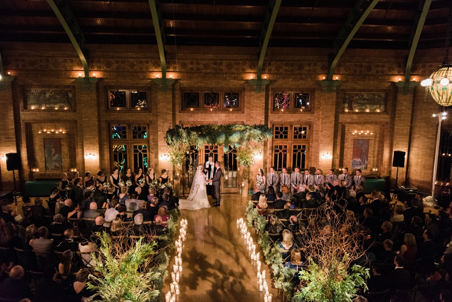 A lush winter wedding ceremony at Cafe Brauer.