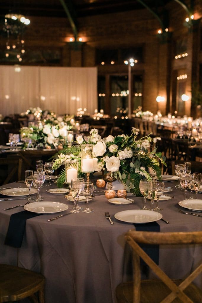 White flowers and greenery dress the Cafe Brauer ballroom.