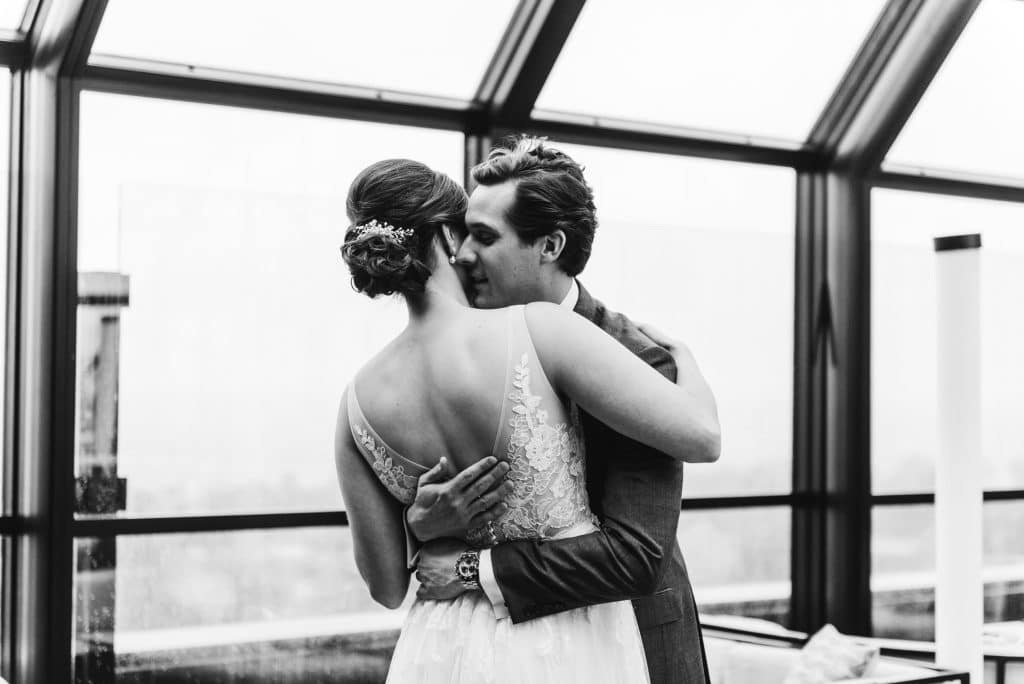 A beautiful first look wedding moment at the JW Parker rooftop.