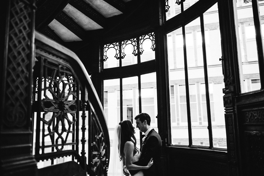 A wedding portrait on the iconic Orielle staircase at the Rookery in Chicago.