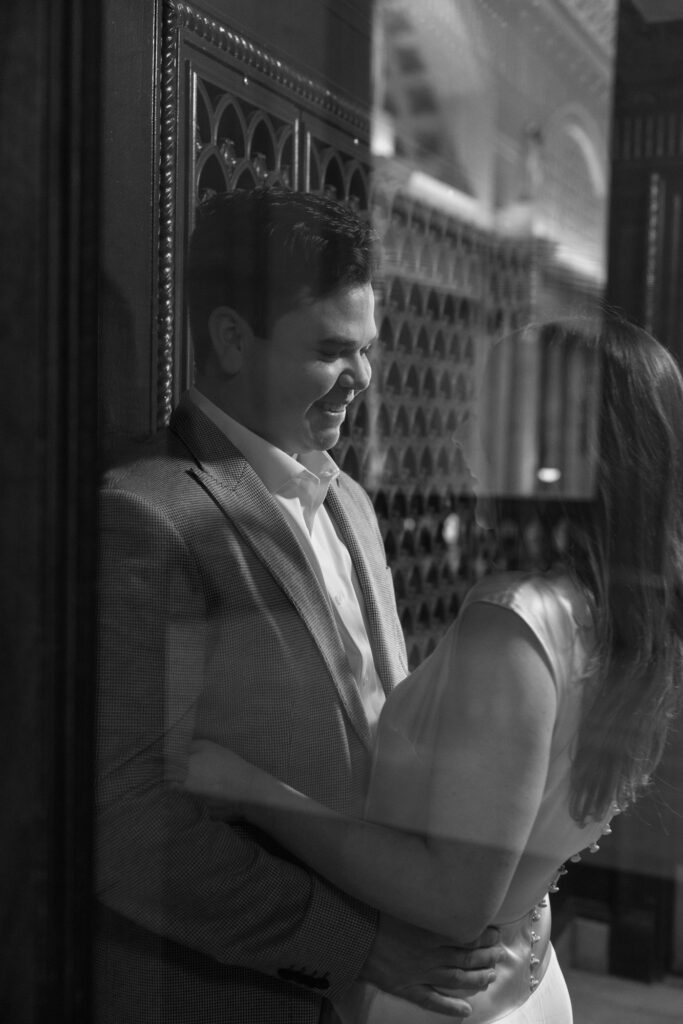 Black and white engagement photo captured in Chicago's Union Station