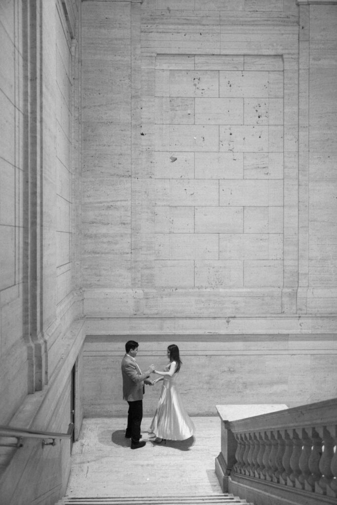 Black and white engagement photo captured in Chicago's Union Station