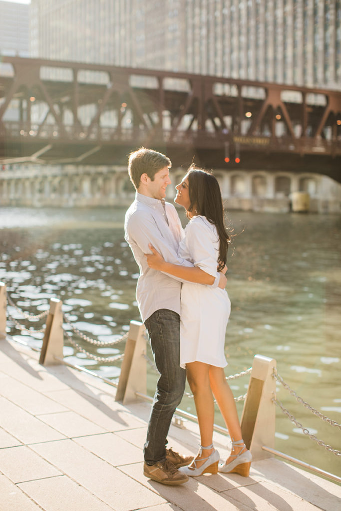 Couple stroll along the Chicago Riverwalk for engagement photo
