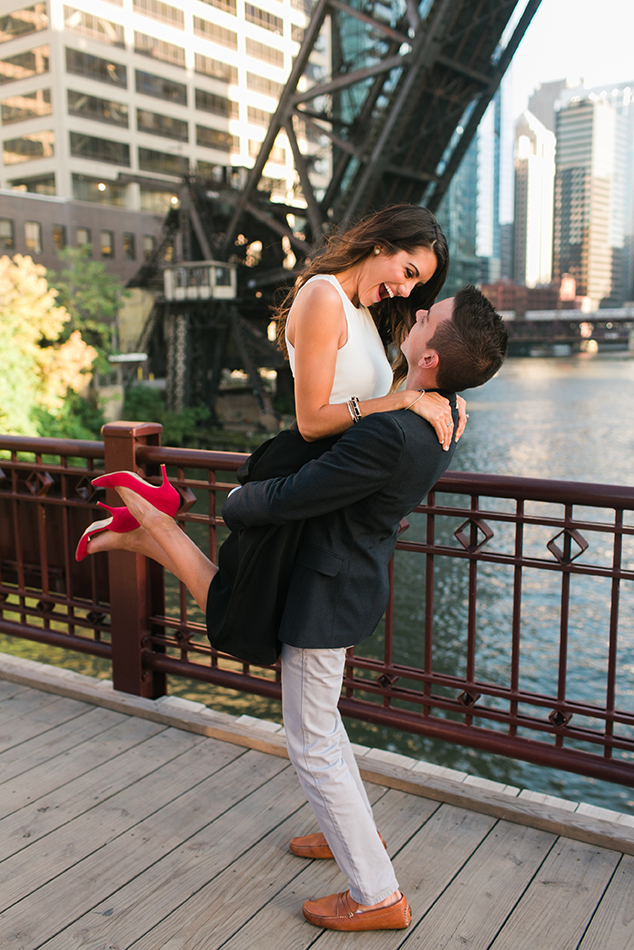 Couple pose on Kinzie Street Bridge in Chicago