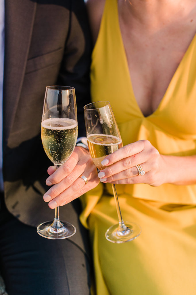 Champagne toast during engagement session