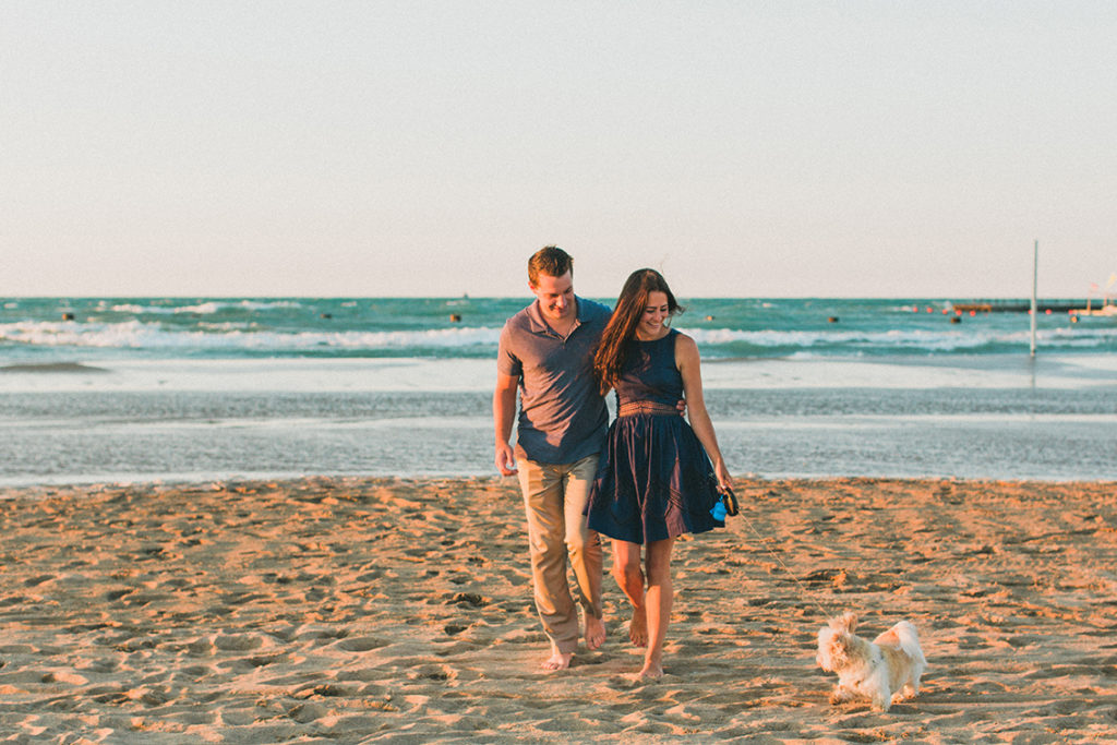 Engaged couple stroll down North Avenue Beach for engagement photo