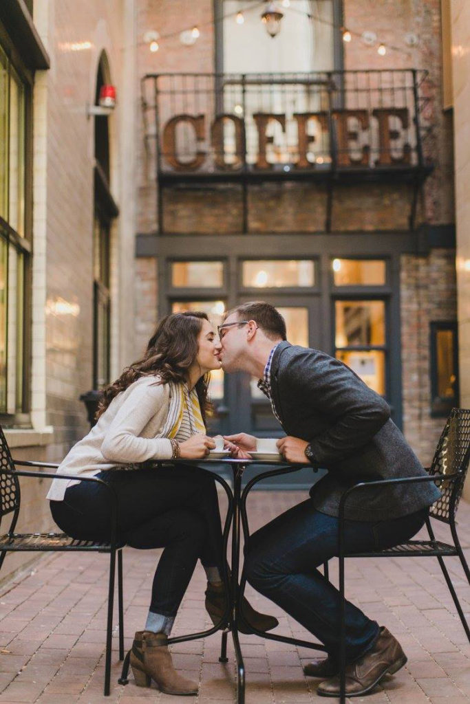 Engaged couple drink coffee for engagement photo