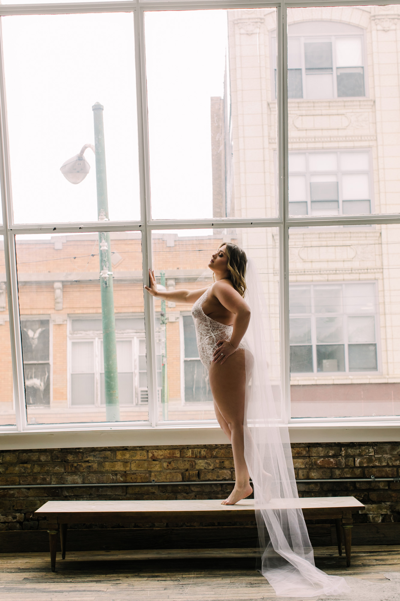 A beautiful bridal boudoir photo taken at Debi Lilly's Parisian styled loft in Chicago.