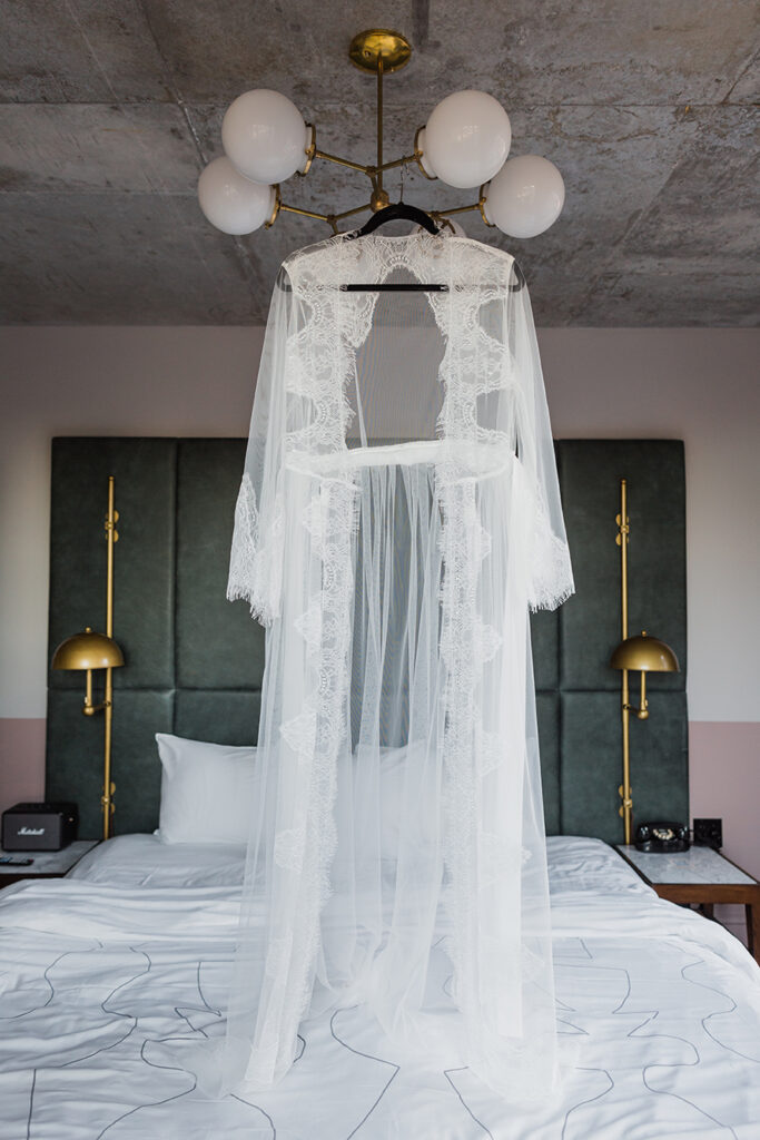 A dramatic white robe for a bridal boudoir session