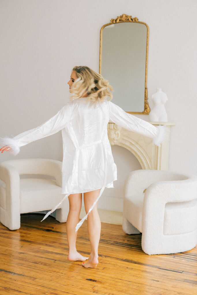 A fun white robe for a bridal boudoir session
