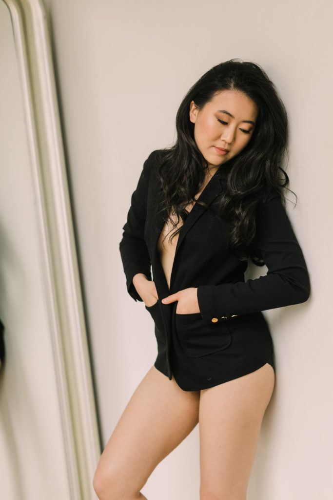 An edgy boudoir photo with a black blazer