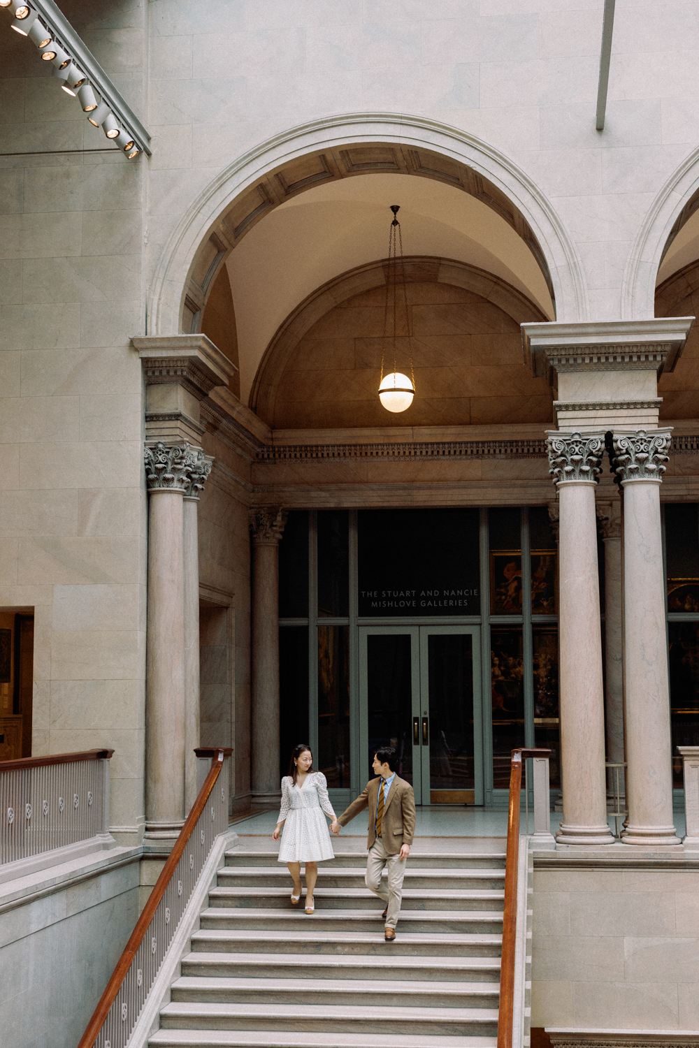 Engagement photo on grand staircase at the Art Institute of Chicago.