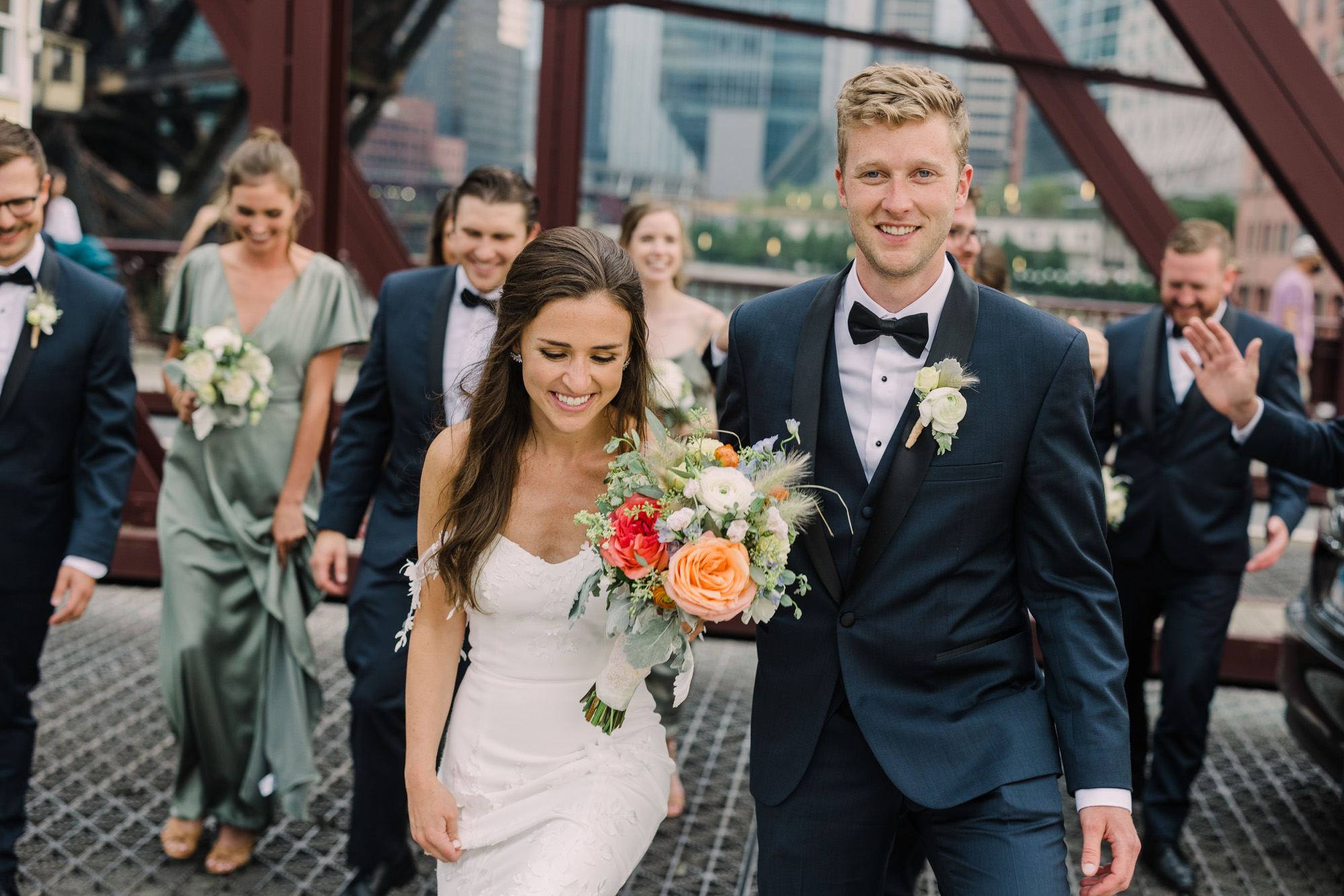 Wedding party pose on the Kinzie Street Bridge in Chicago's West Loop for a portrait.