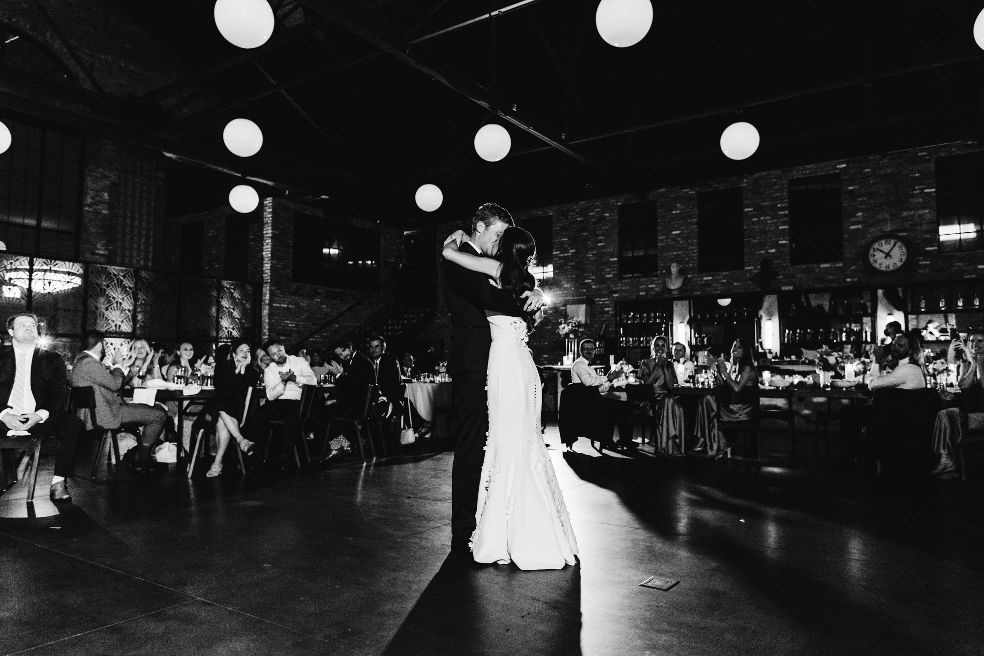 A bride and groom share their first dance at their City Hall wedding in the West Loop of Chicago.