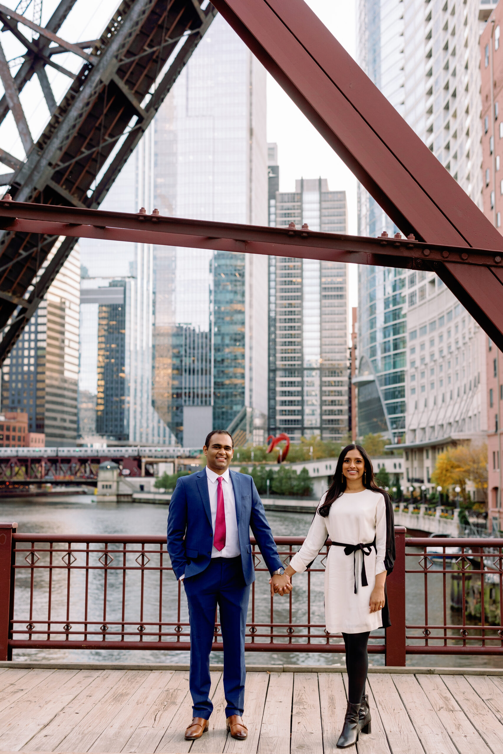 An engagement photo taken on the Kinzie Street Bridge in Chicago.