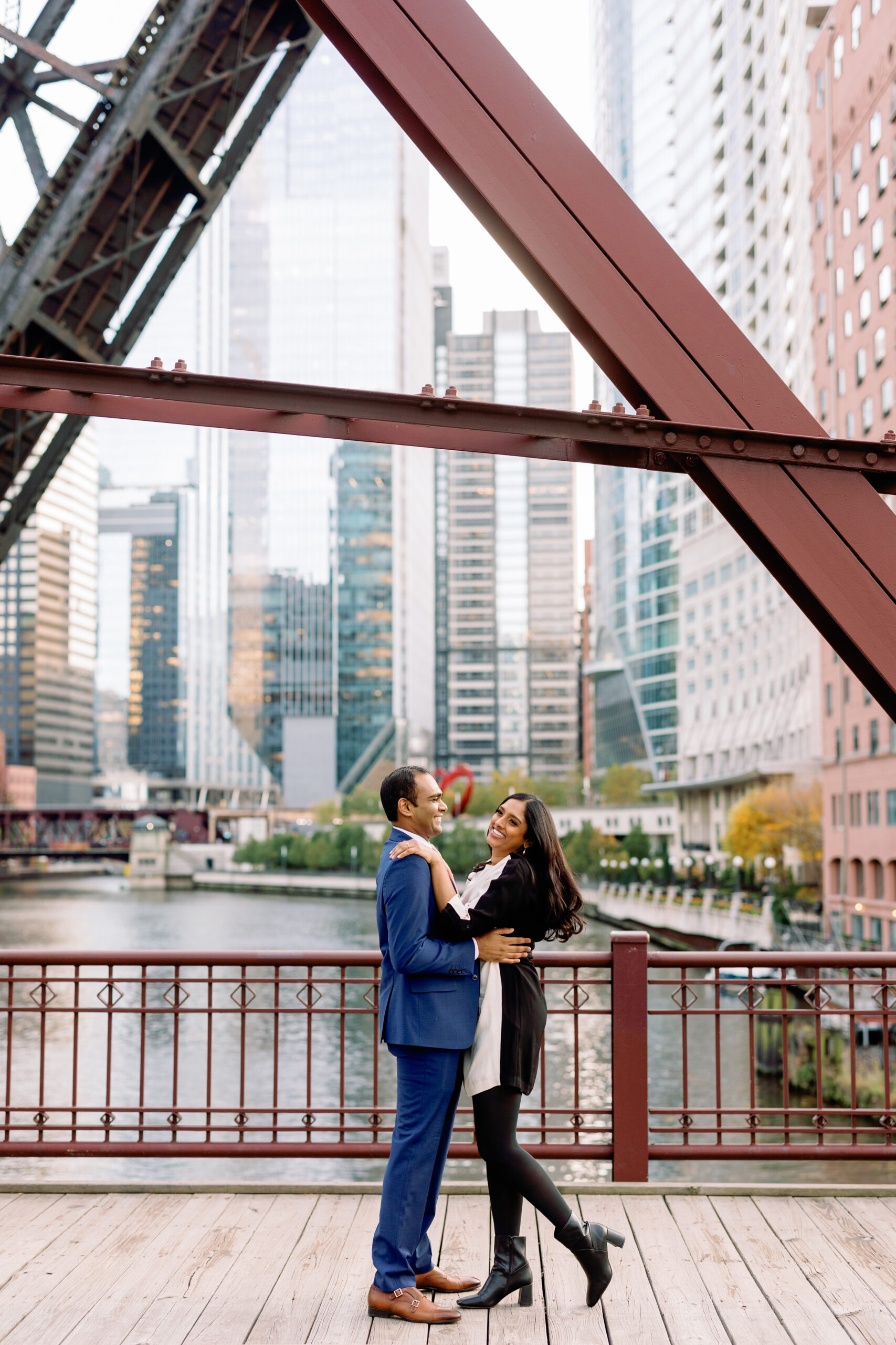 An engagement photo taken on the Kinzie Street Bridge in Chicago.