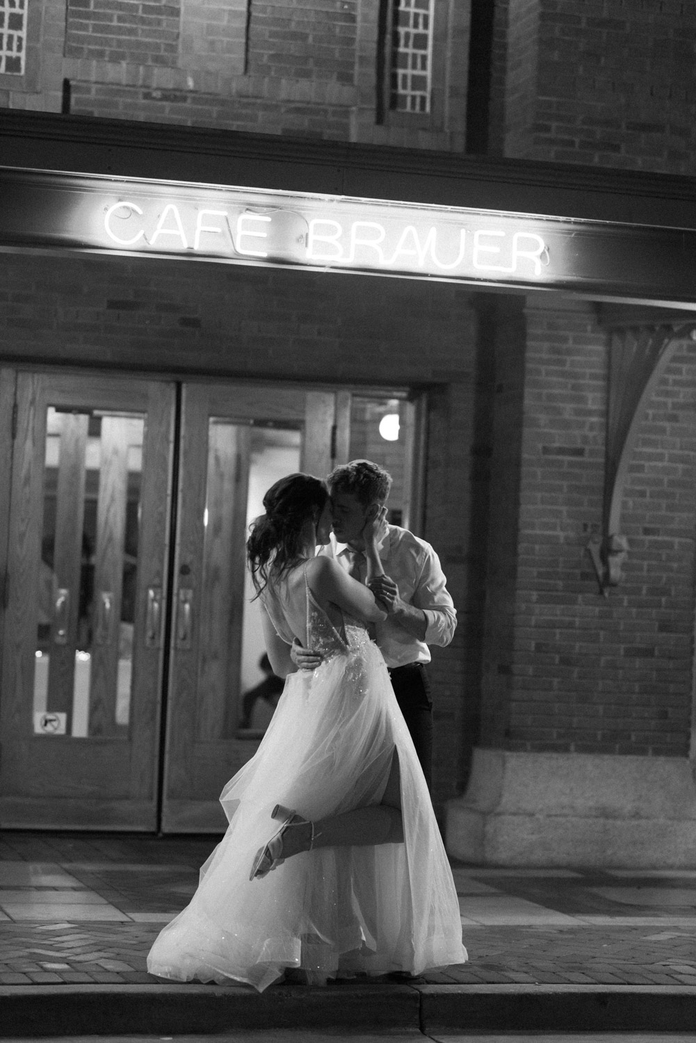 Evening wedding portraits outside of Cafe Brauer