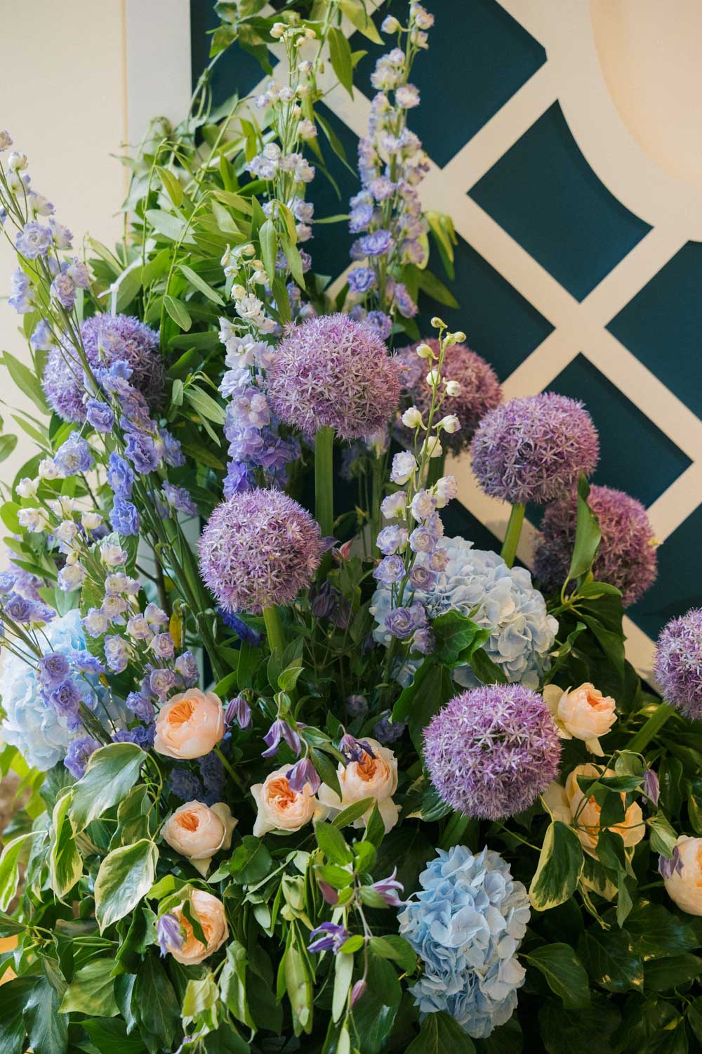 Purple, blue and peach wedding flowers.