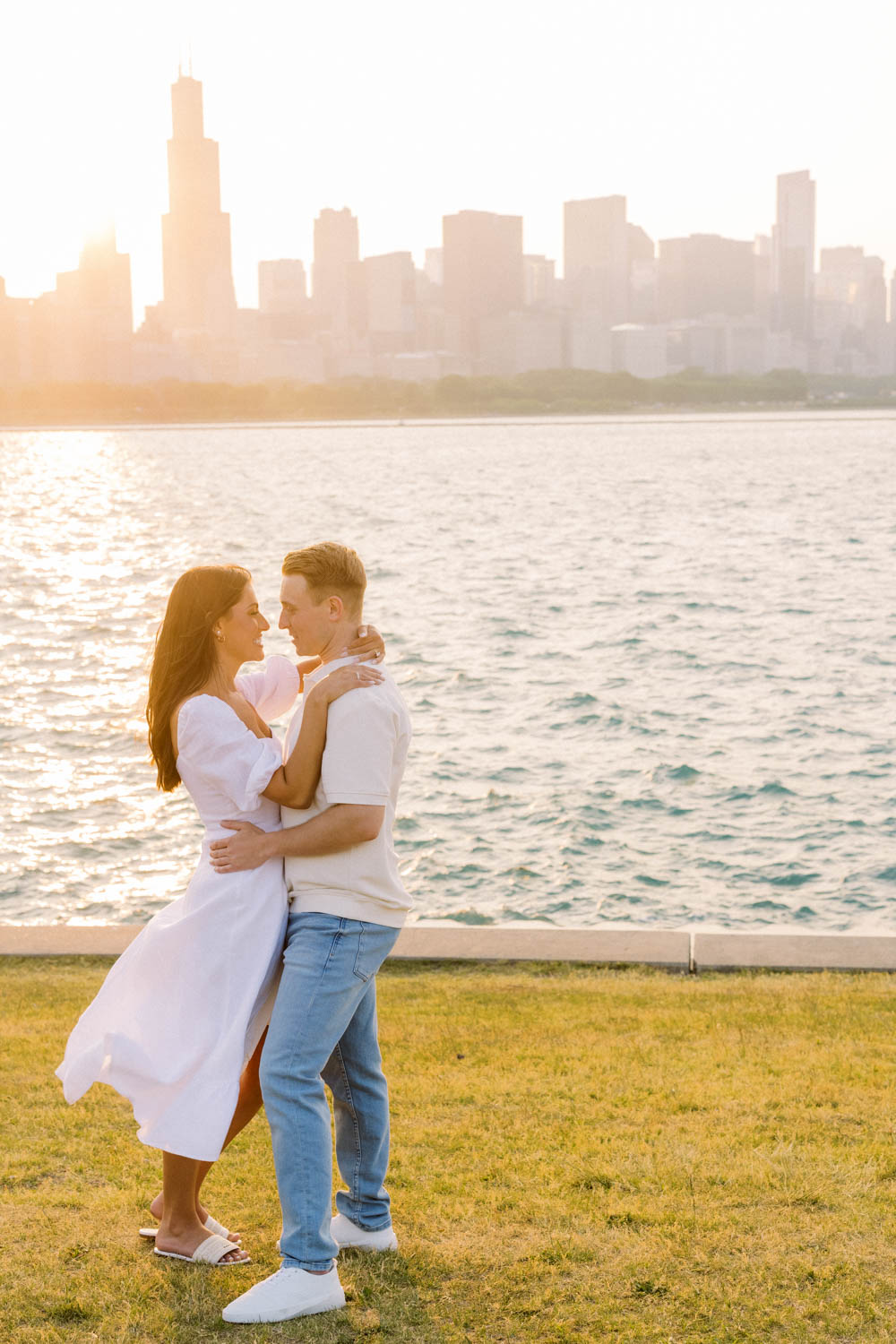 A sunset engagement photo taken along the lakefront with the Chicago skyline