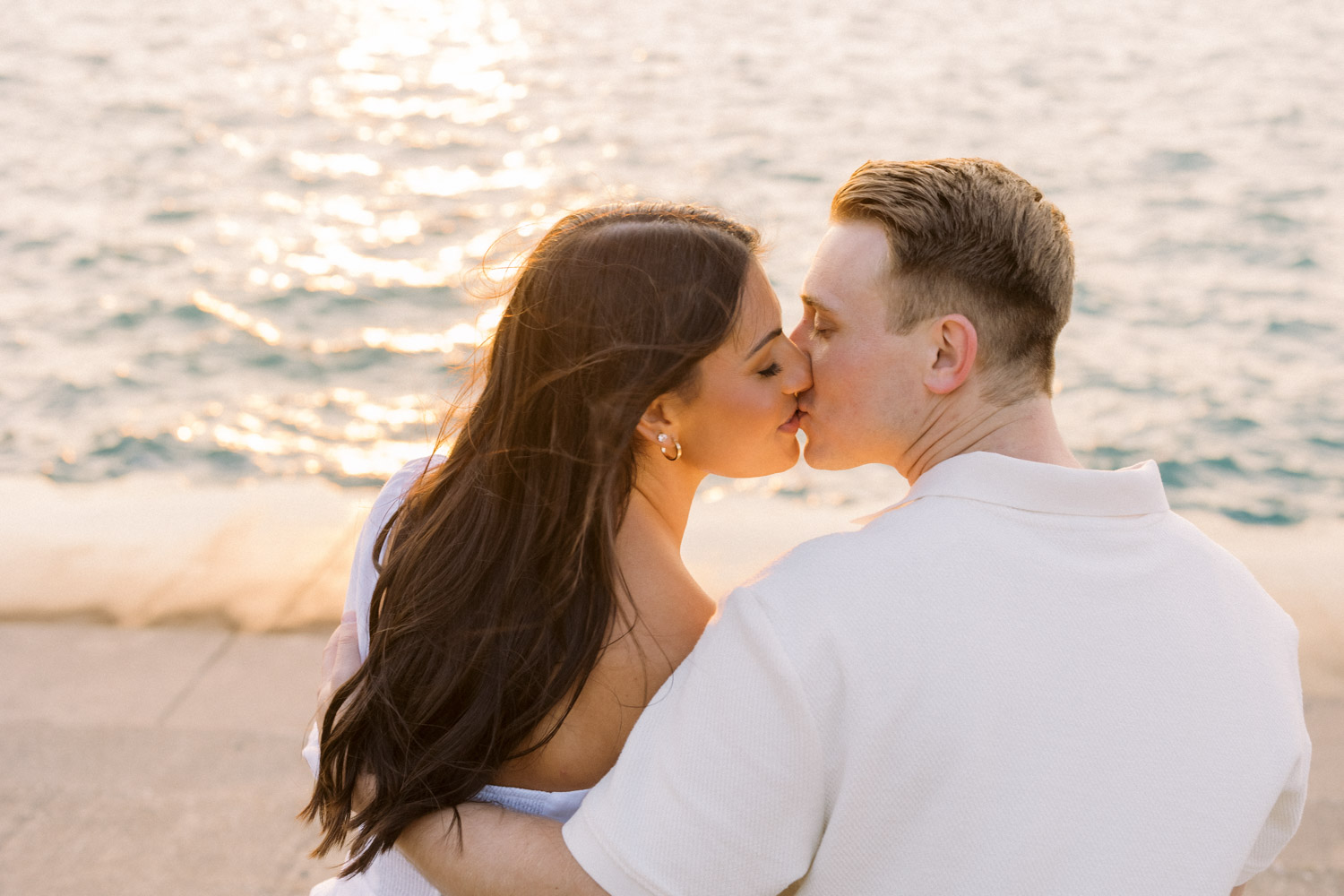 A sunset engagement photo taken along the lakefront with the Chicago skyline