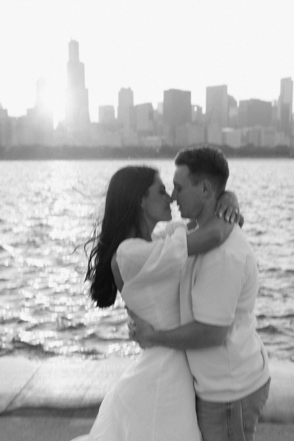 A classic black and white engagement photo with a slight camera blur