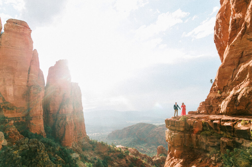 An iconic Sedona engagement photo taken at Cathedral Rock at sunset