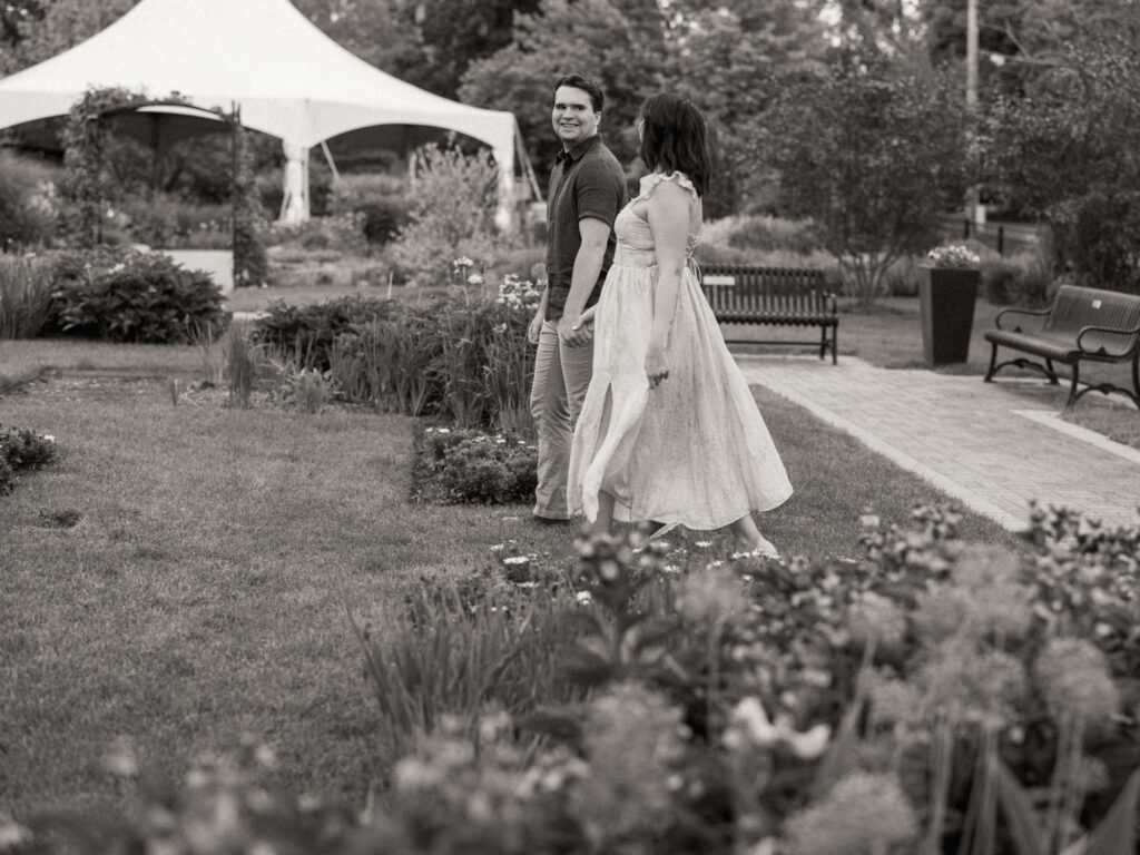 A candid black and white engagement photo taken in Elmhurst, Illinois