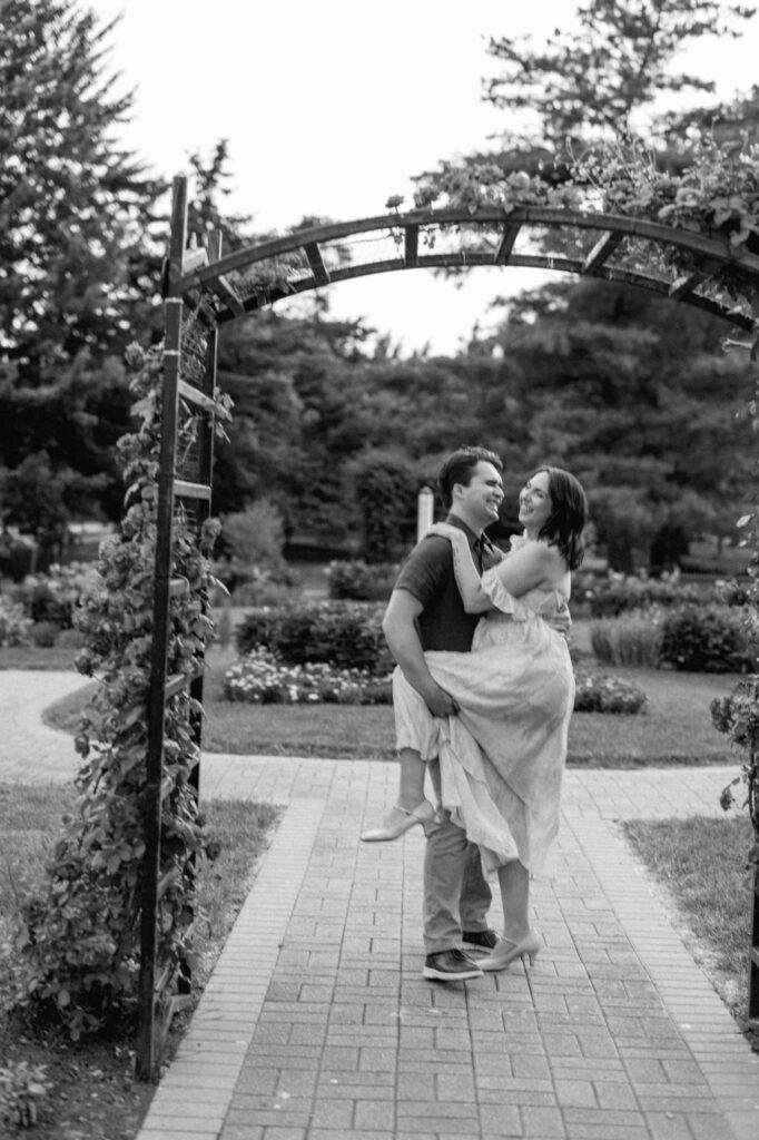 A blurry black and white engagement photo taken at a secret garden in the West Suburbs of Chicago
