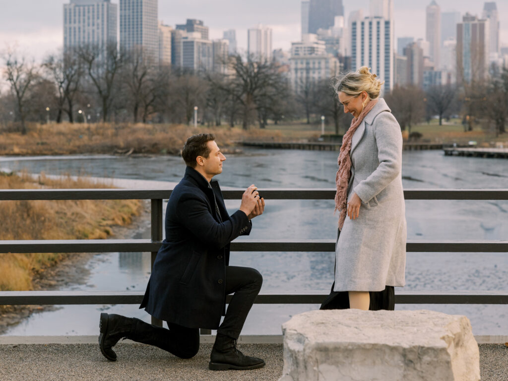 Surprise proposal at Lincoln Park’s Nature Boardwalk with Chicago skyline in the background