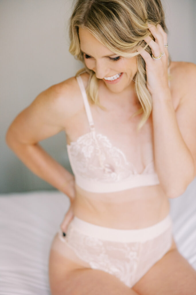 Confident and joyful moment during an empowering boudoir experience in Chicago
