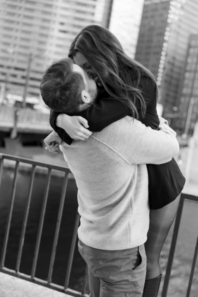 Couple embracing joyfully just after their proposal