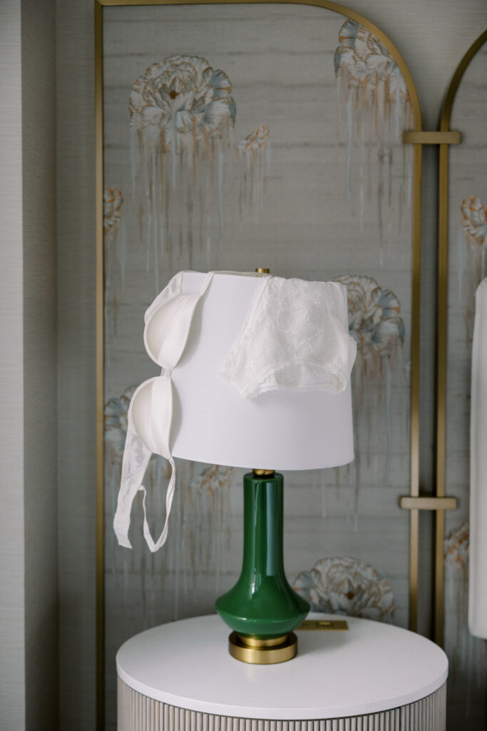 Close-up of lingerie details during high-end boudoir session in Chicago hotel