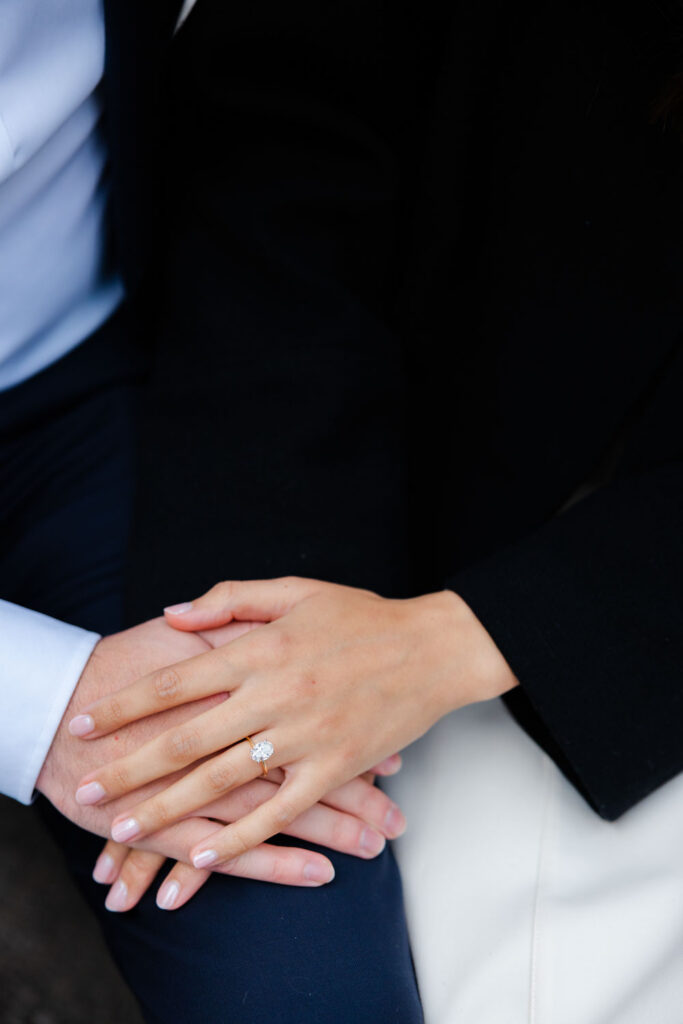 Close-up of engagement ring on bride-to-be’s hand
