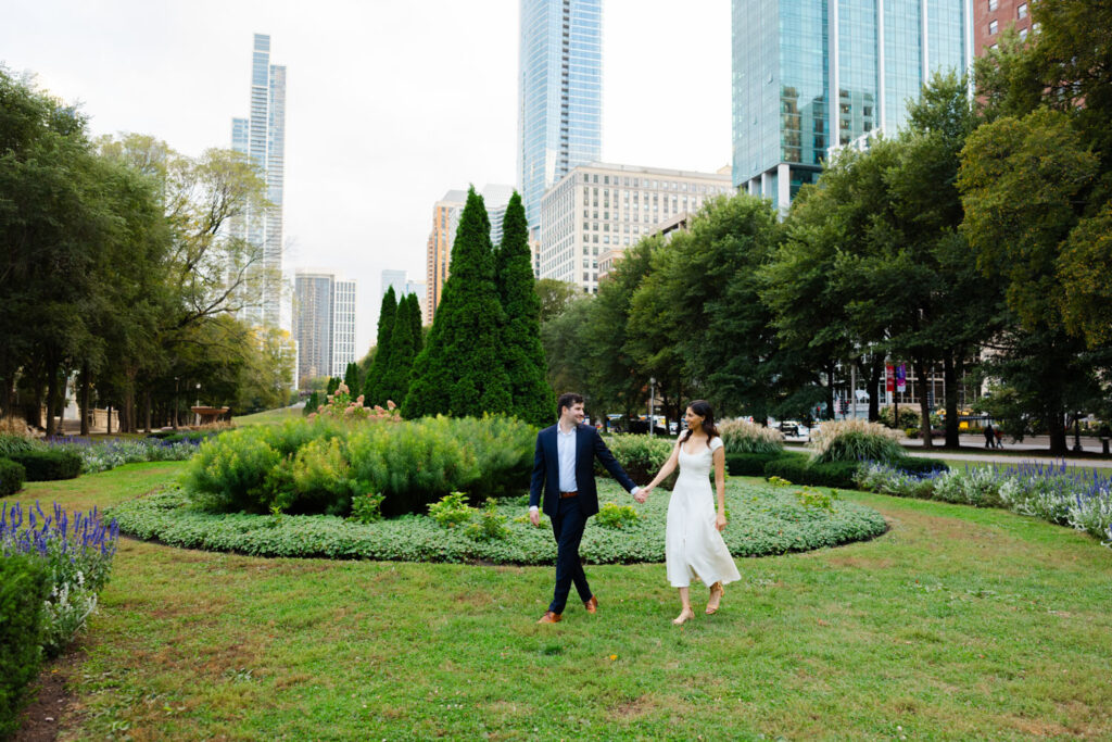 Couple walking through formal garden along Michigan Avenue in Chicago