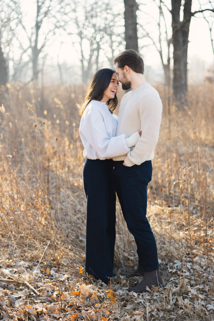Couple embracing in frosted field at Elawa Farm Lake Forest engagement session