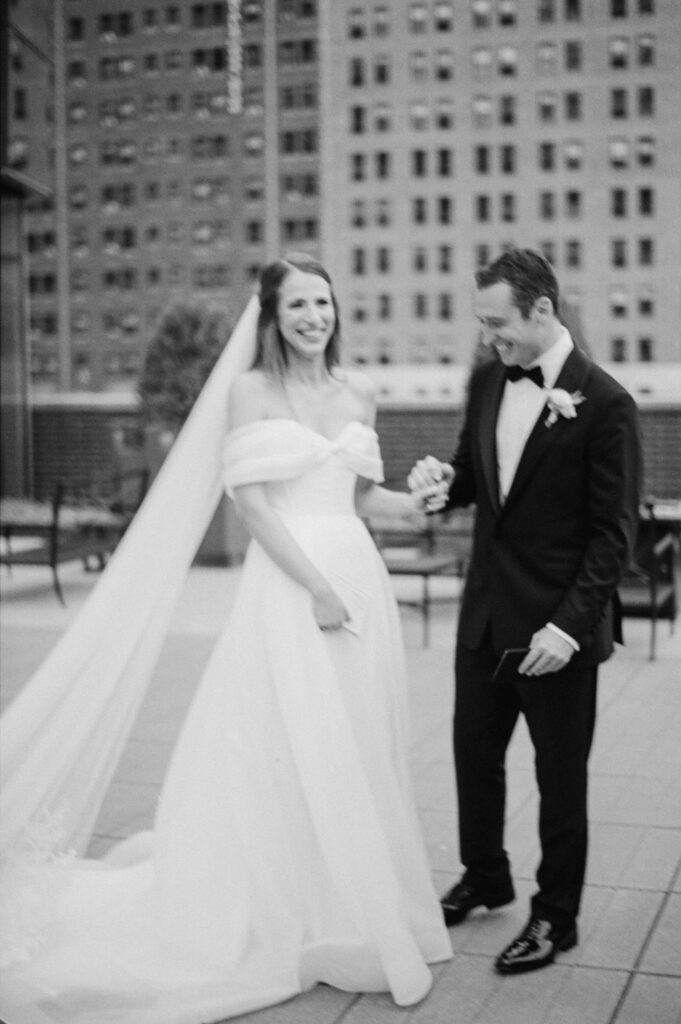 Bride and groom standing together on a rooftop terrace in downtown Chicago