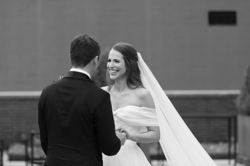 Bride and groom meeting for their first look on a rooftop terrace in Chicago