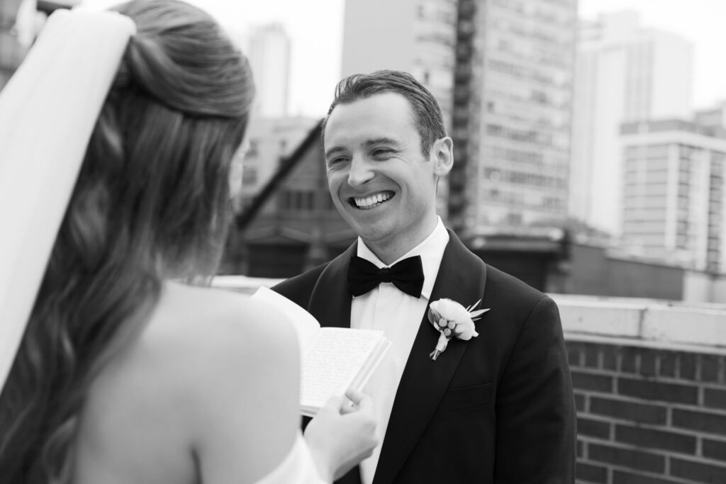 Bride and groom laughing together during their first look
