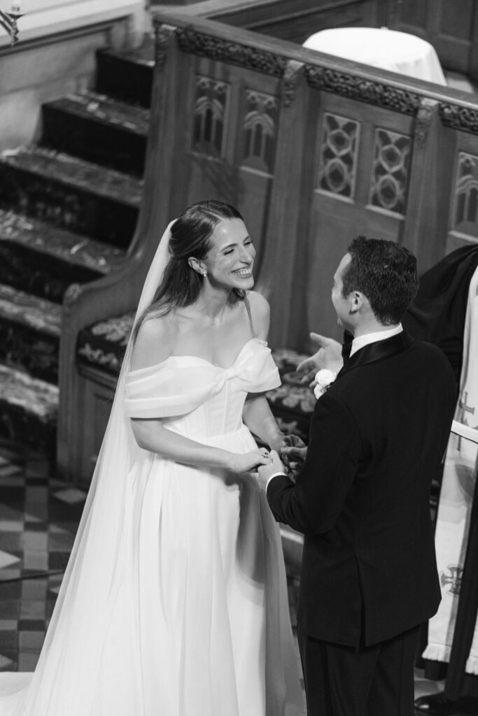 Bride and groom holding hands during ceremony at Fourth Presbyterian Church in Chicago