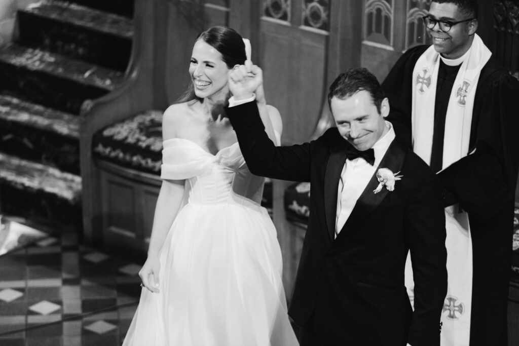 Bride and groom walking back down the aisle after the ceremony