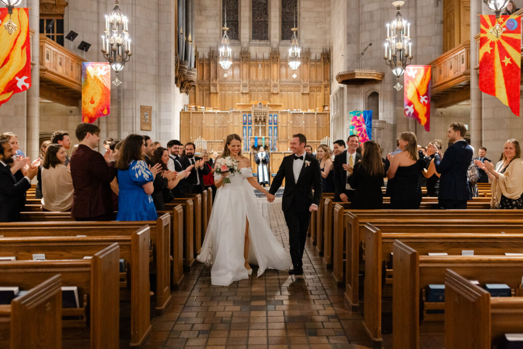 Bride and groom walking back down the aisle after the ceremony