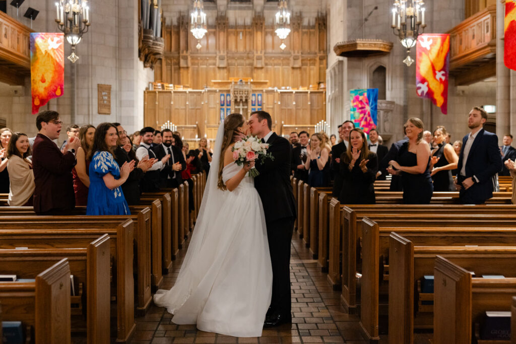 Bride and groom walking back down the aisle after the ceremony