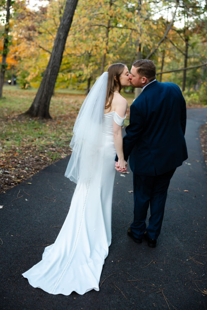 Bride and groom walking together after wedding portraits