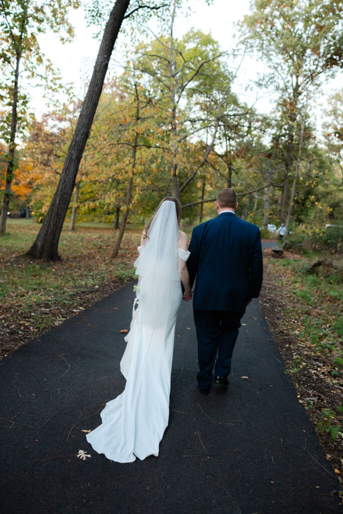 Bride and groom walking together after wedding portraits