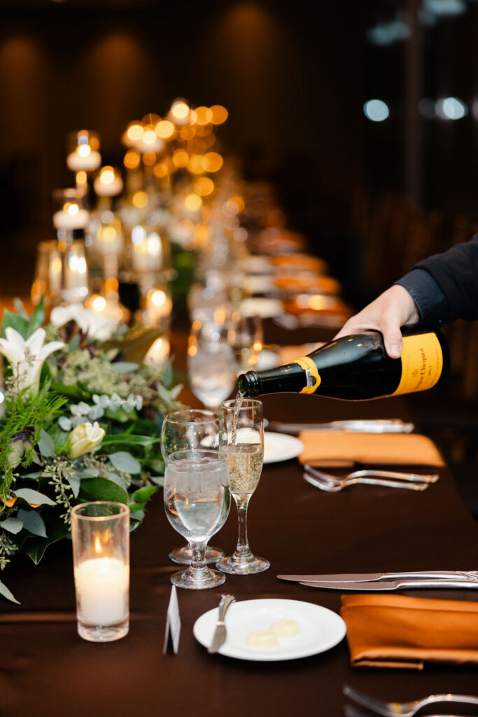 Champagne being poured during wedding reception