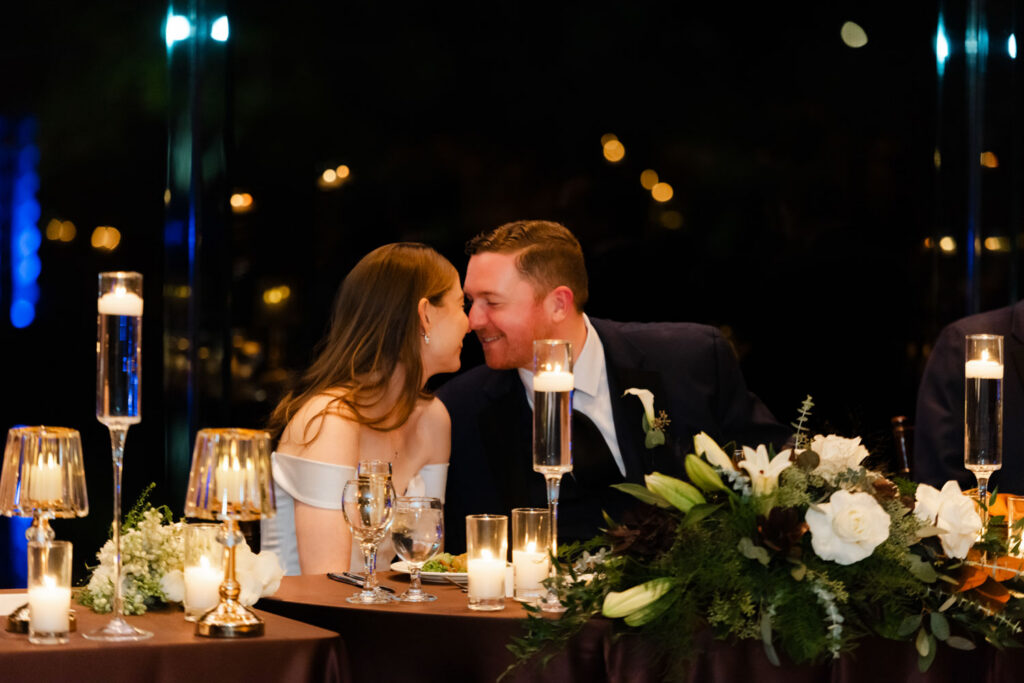 Bride and groom laughing together during reception